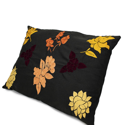 Handmade Cushion Cover with orange embroidered details.