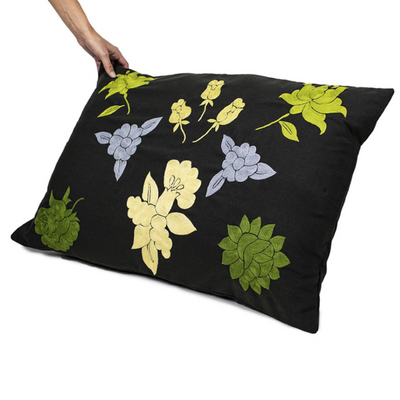 Handmade Cushion Cover with green embroidered details.