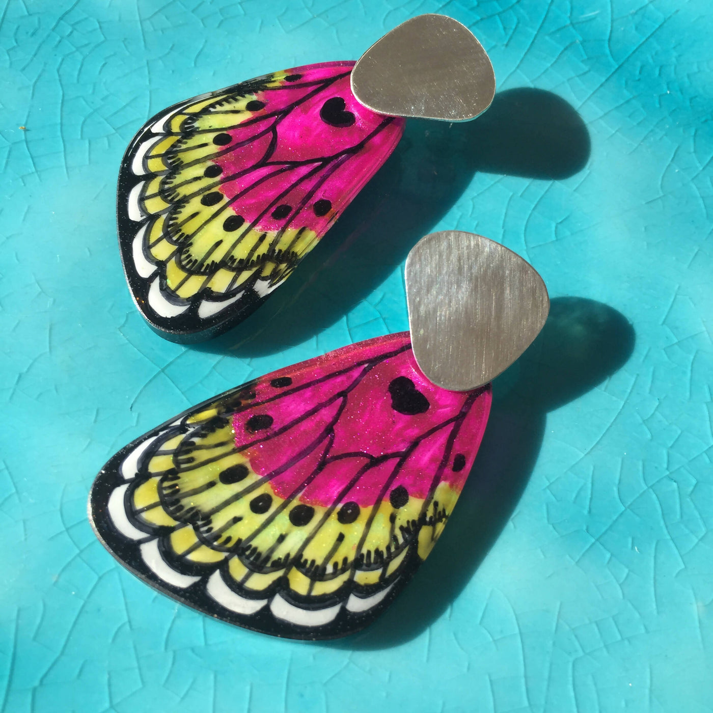 Dangling Fuchsia Wing Earrings